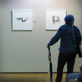 An attendee assesses sketches