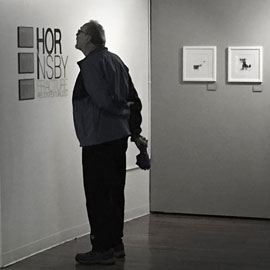 An attendee takes in Hornsbys credentials and story